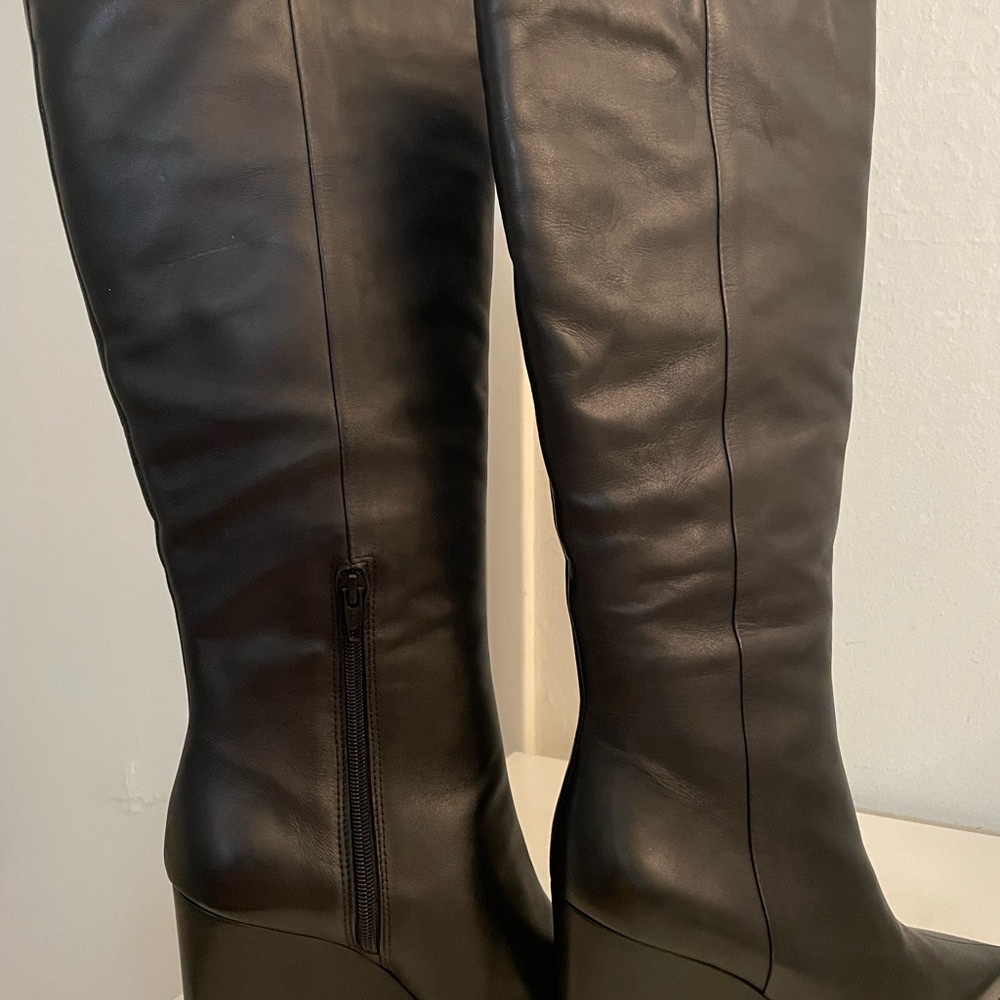 Size 8 black leather wide calf Steve Madden boots. New,  never worn.